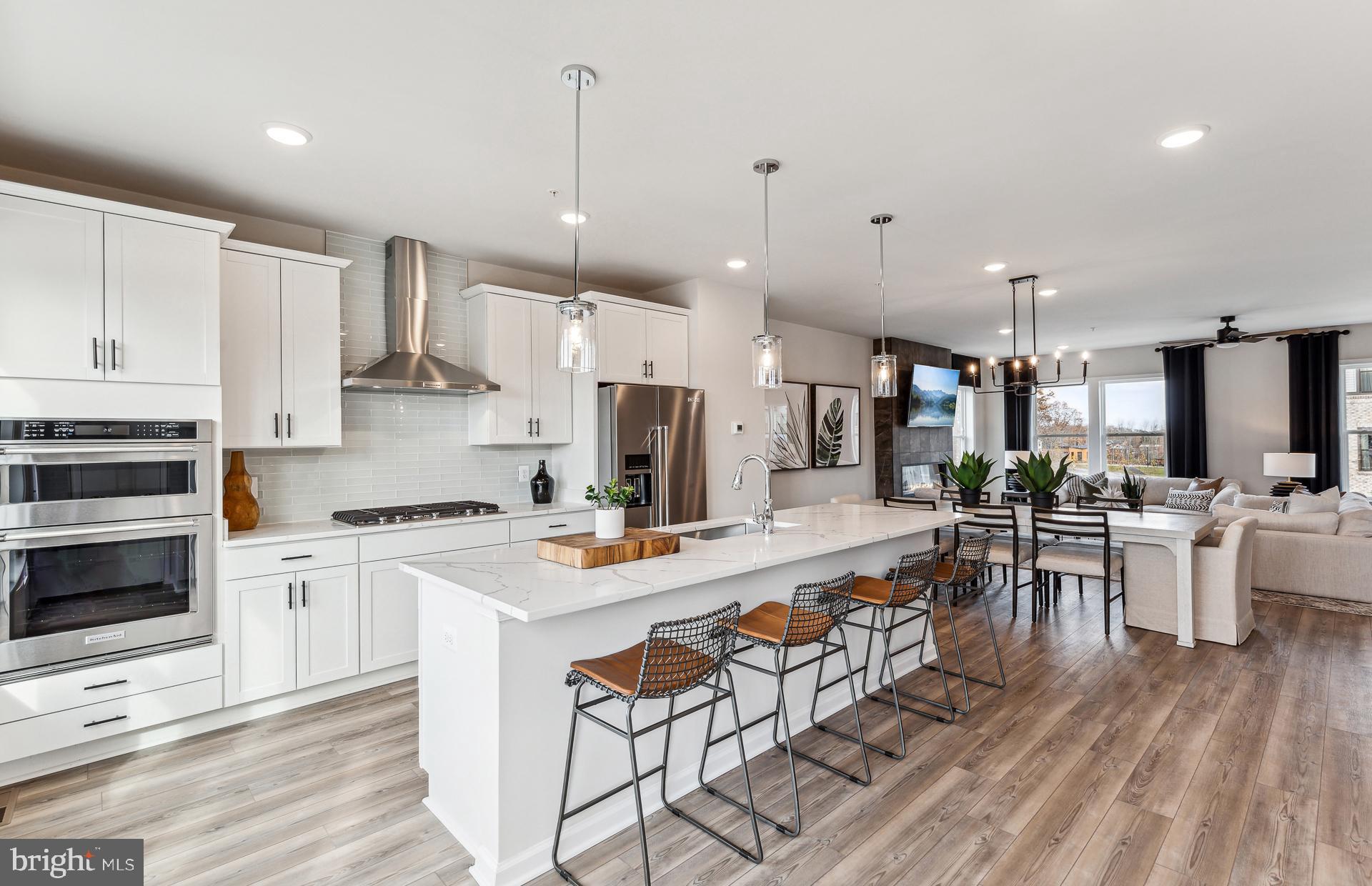 42609 Houdini Rst Terrace Leesburg, VA 20176 - Photo 11 of 27 a large kitchen with lots of counter space a sink appliances and cabinets