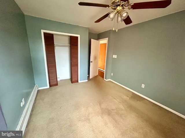 a view of a livingroom with a chandelier fan