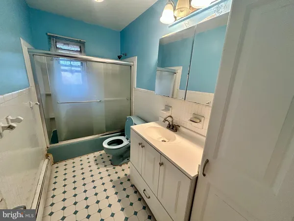 a bathroom with a double vanity sink and mirror