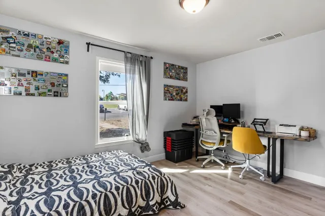 a bedroom with a bed and a window