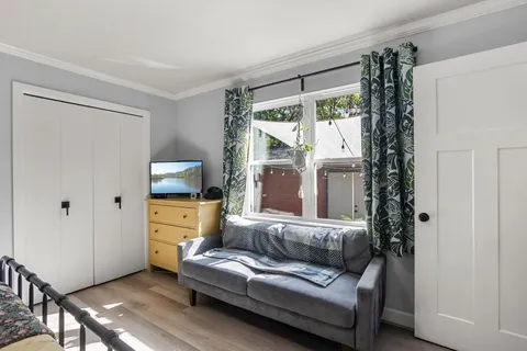 a living room with furniture and a window