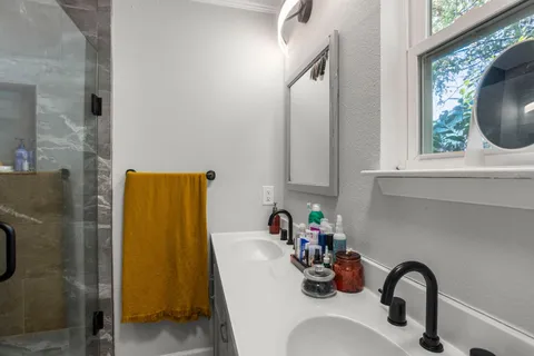 a bathroom with a sink and a mirror