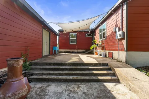 a view of backyard with seating space