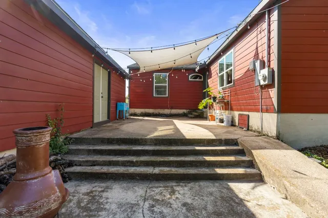 a view of backyard with seating space