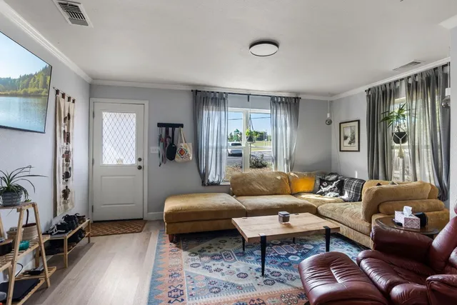 a living room with furniture and a window