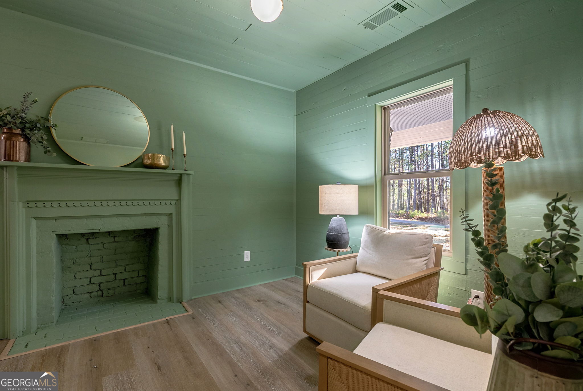 1021 Twins Road Greensboro, GA 30642 - Photo 11 of 32 a living room with furniture and a fireplace
