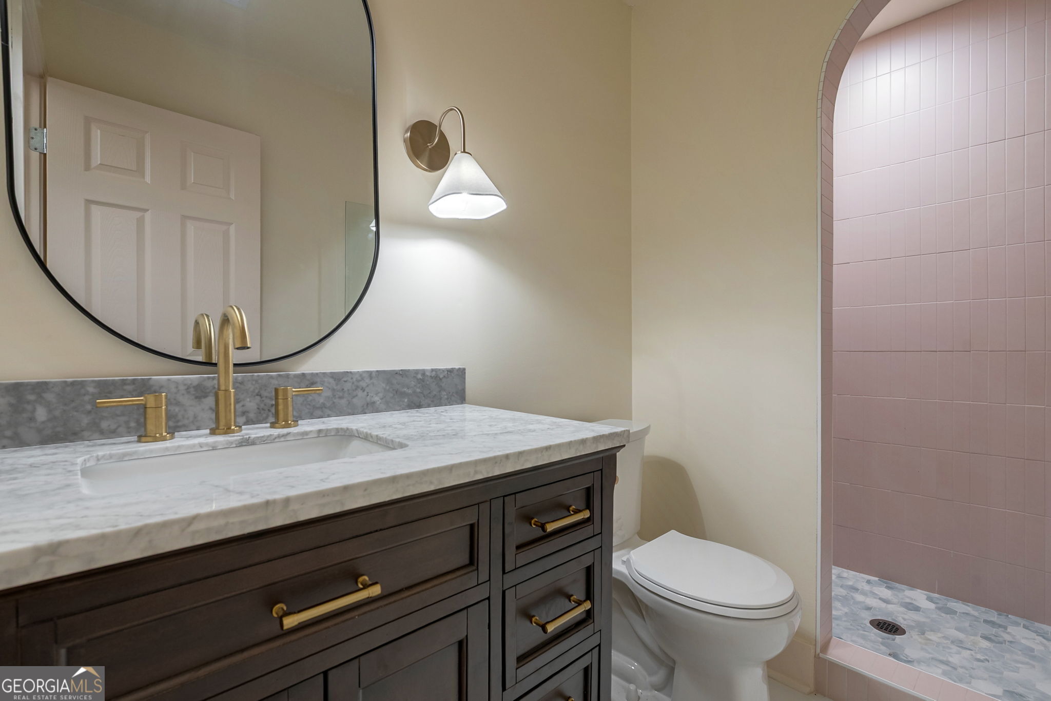 1021 Twins Road Greensboro, GA 30642 - Photo 15 of 32 a bathroom with a granite countertop toilet sink and mirror