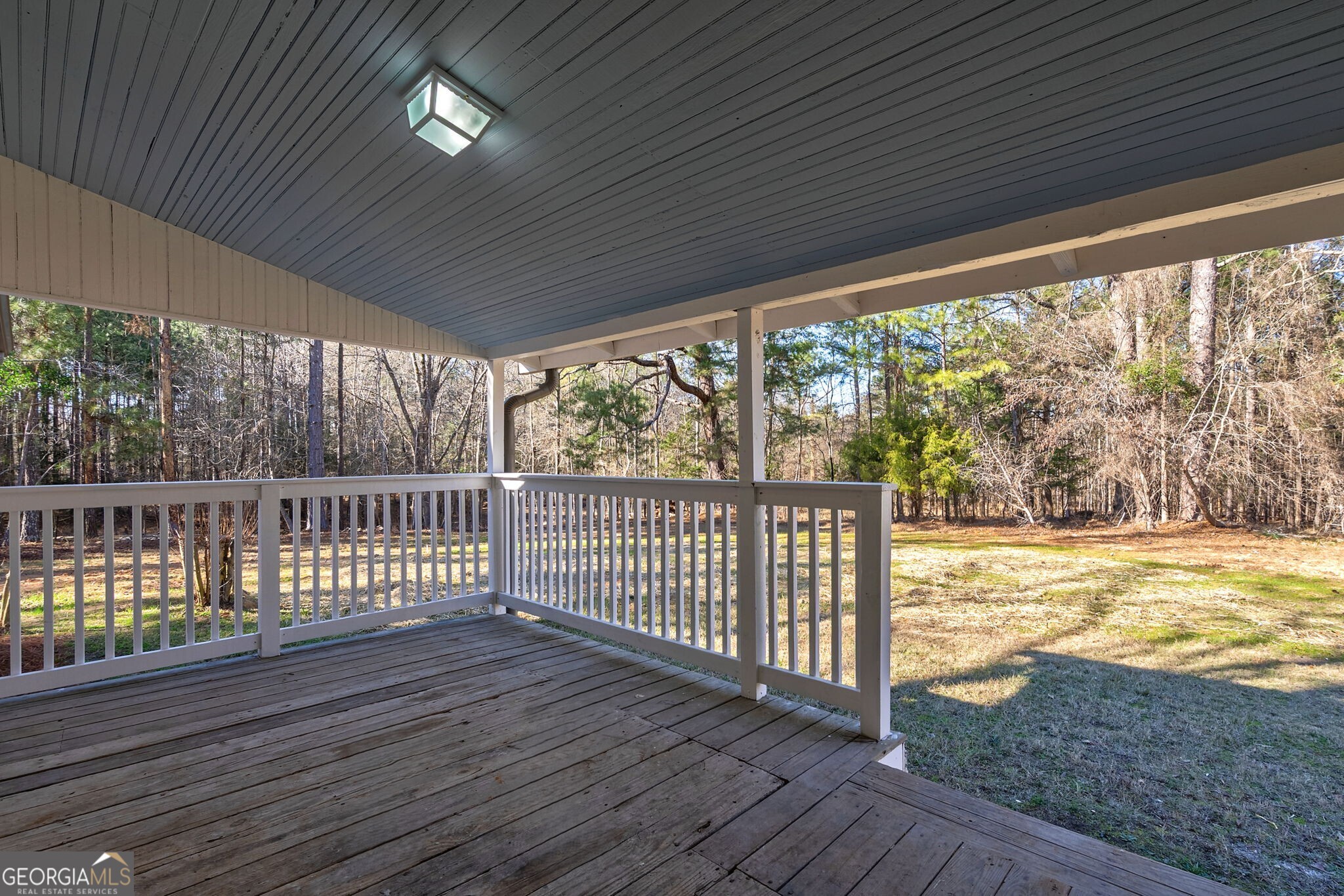 1021 Twins Road Greensboro, GA 30642 - Photo 18 of 32 a view of a balcony with wooden floor