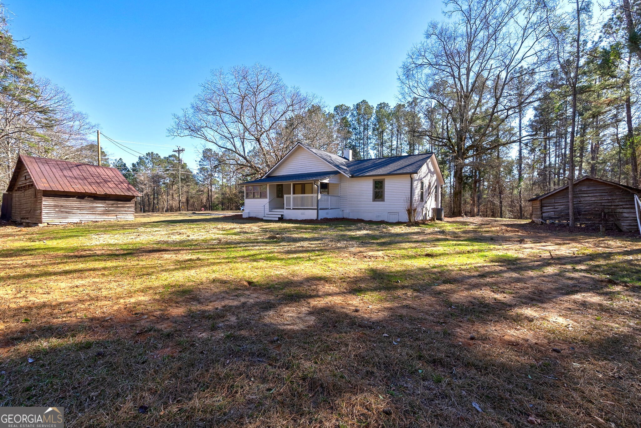 1021 Twins Road Greensboro, GA 30642 - Photo 20 of 32 a view of a house with a swimming pool