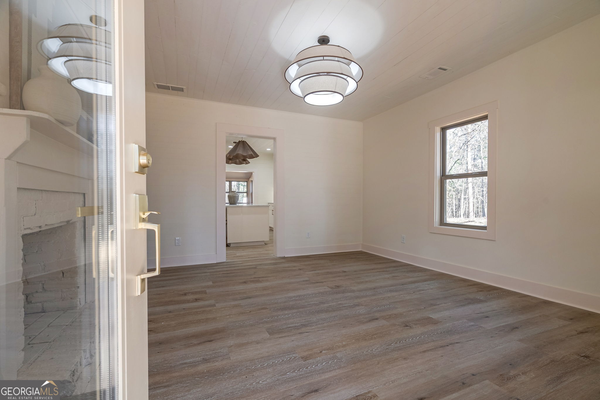 1021 Twins Road Greensboro, GA 30642 - Photo 2 of 32 a view of empty room with wooden floor