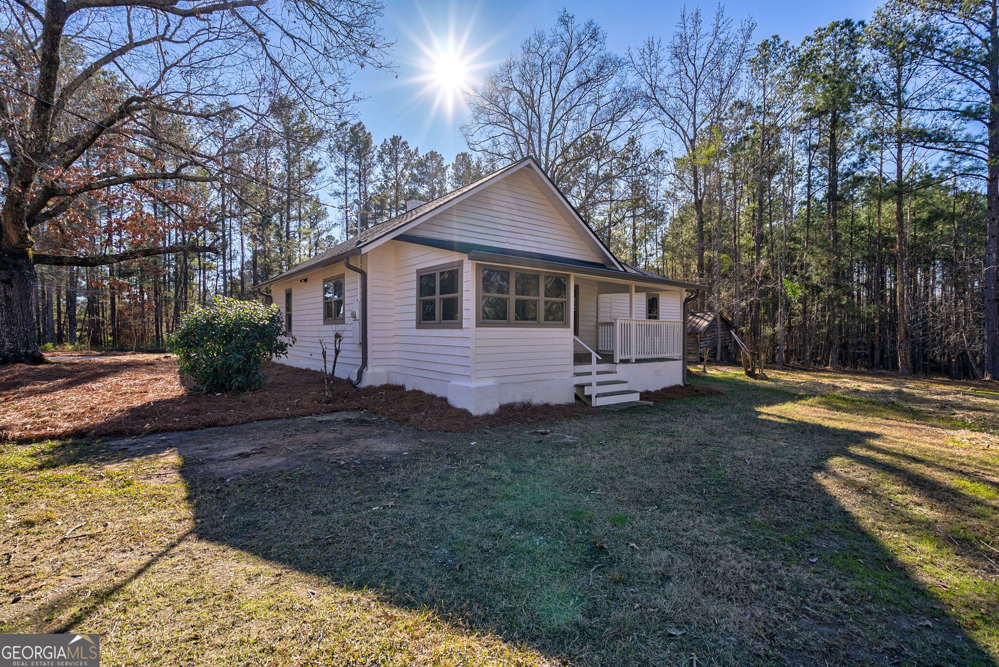 1021 Twins Road Greensboro, GA 30642 - Photo 21 of 32 a front view of a house with garden
