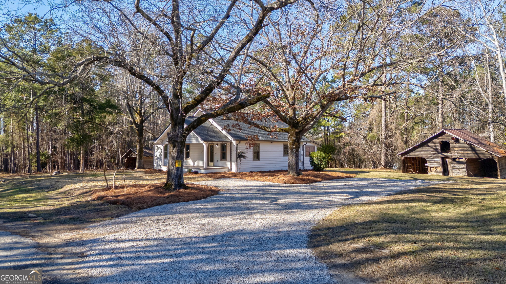 1021 Twins Road Greensboro, GA 30642 - Photo 27 of 32 a front view of a house with a yard