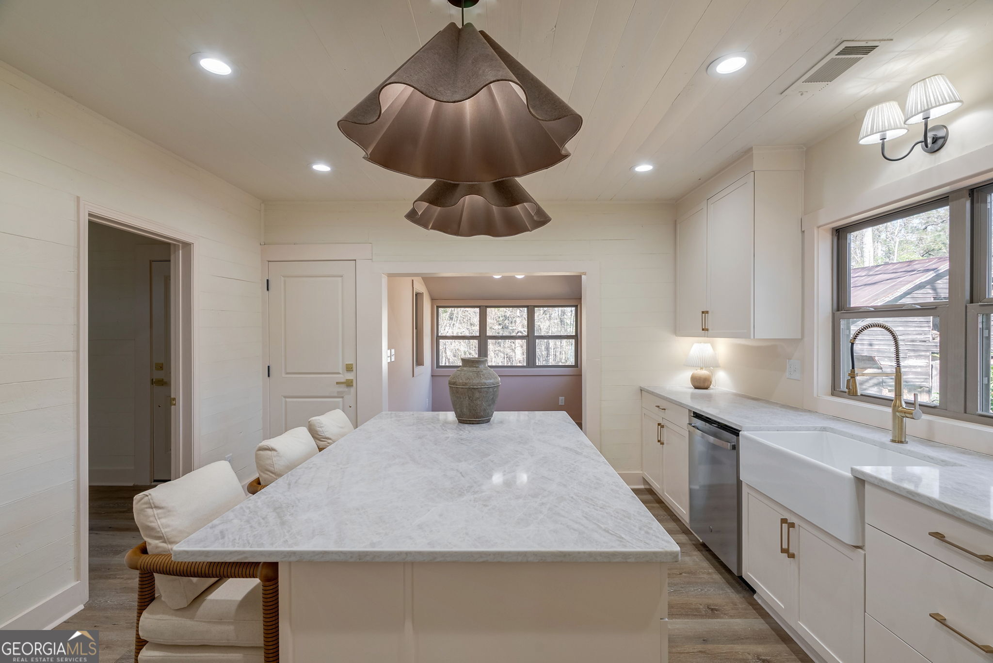 1021 Twins Road Greensboro, GA 30642 - Photo 3 of 32 a large bedroom with a large bed and chandelier