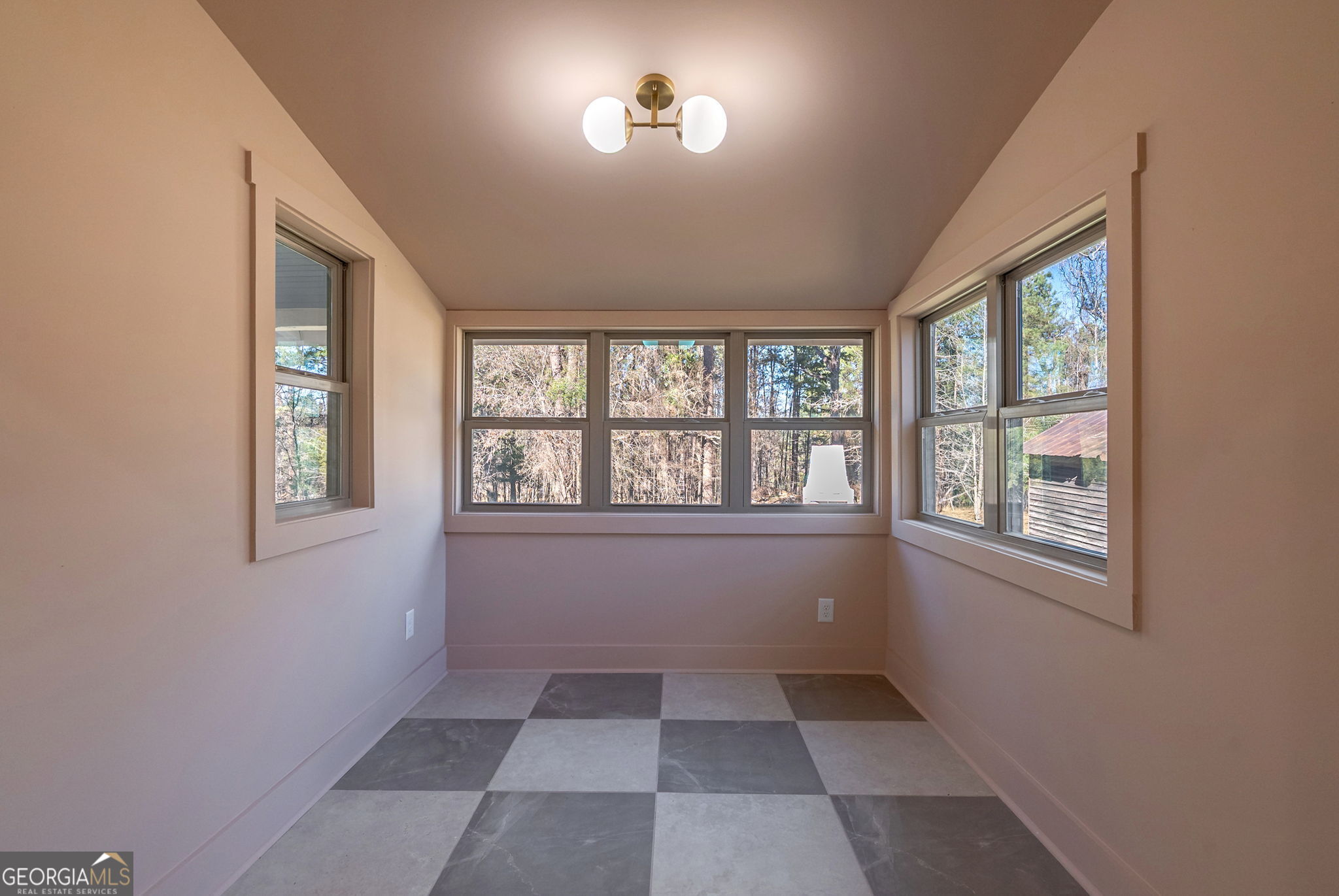 1021 Twins Road Greensboro, GA 30642 - Photo 7 of 32 an empty room with windows
