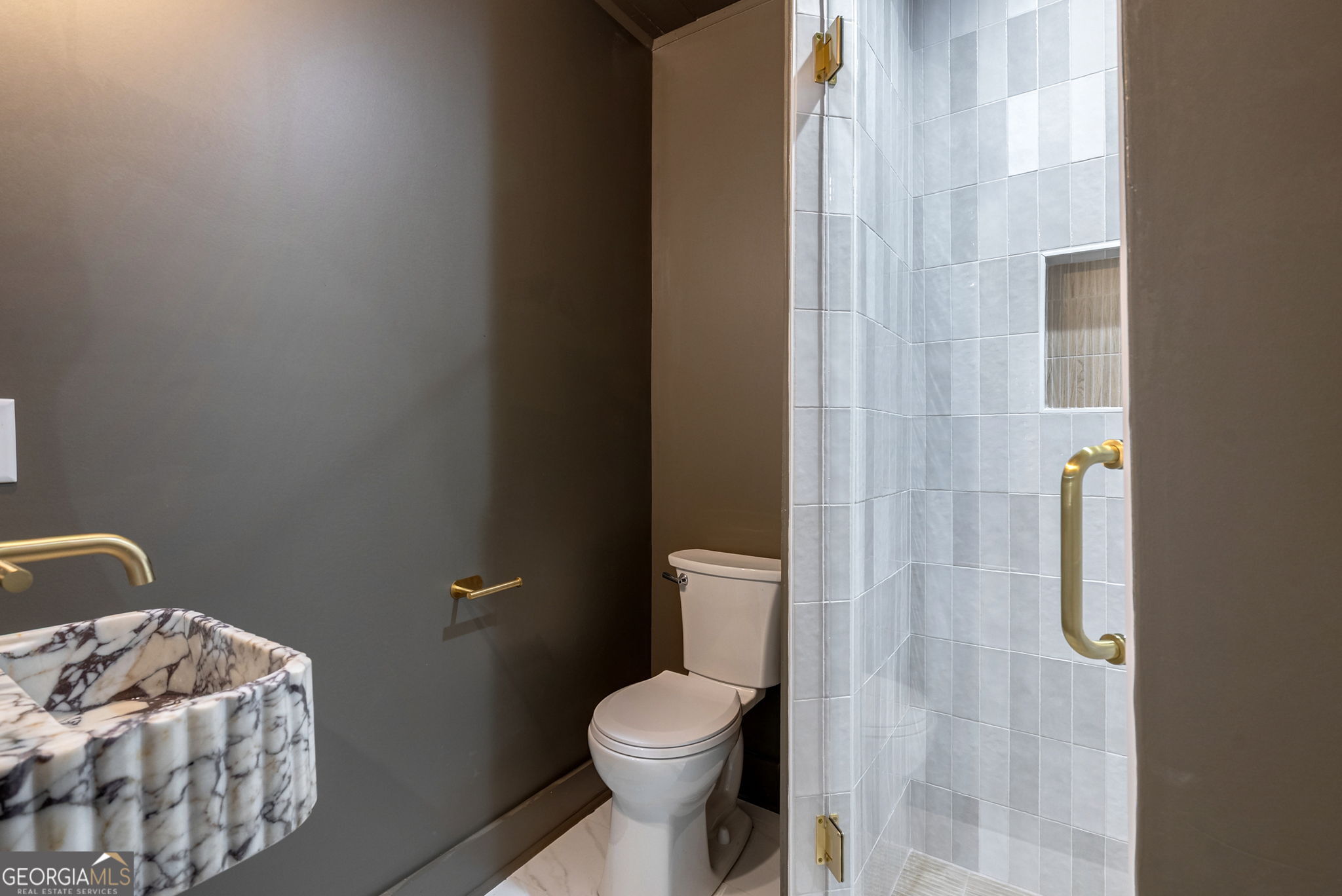 1021 Twins Road Greensboro, GA 30642 - Photo 8 of 32 a white toilet sitting next to a bathroom sink