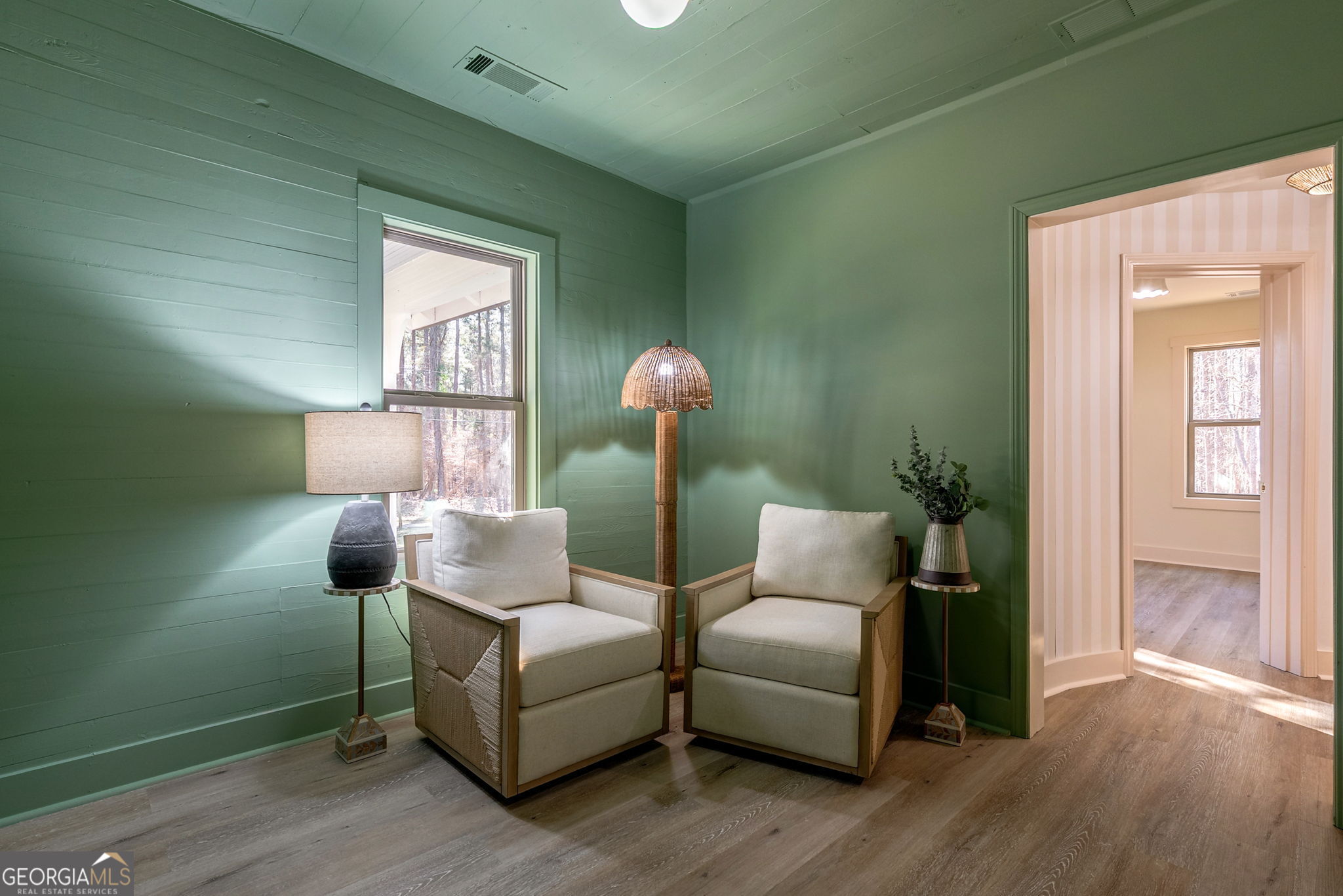 1021 Twins Road Greensboro, GA 30642 - Photo 10 of 32 a living room with furniture and a wooden floor