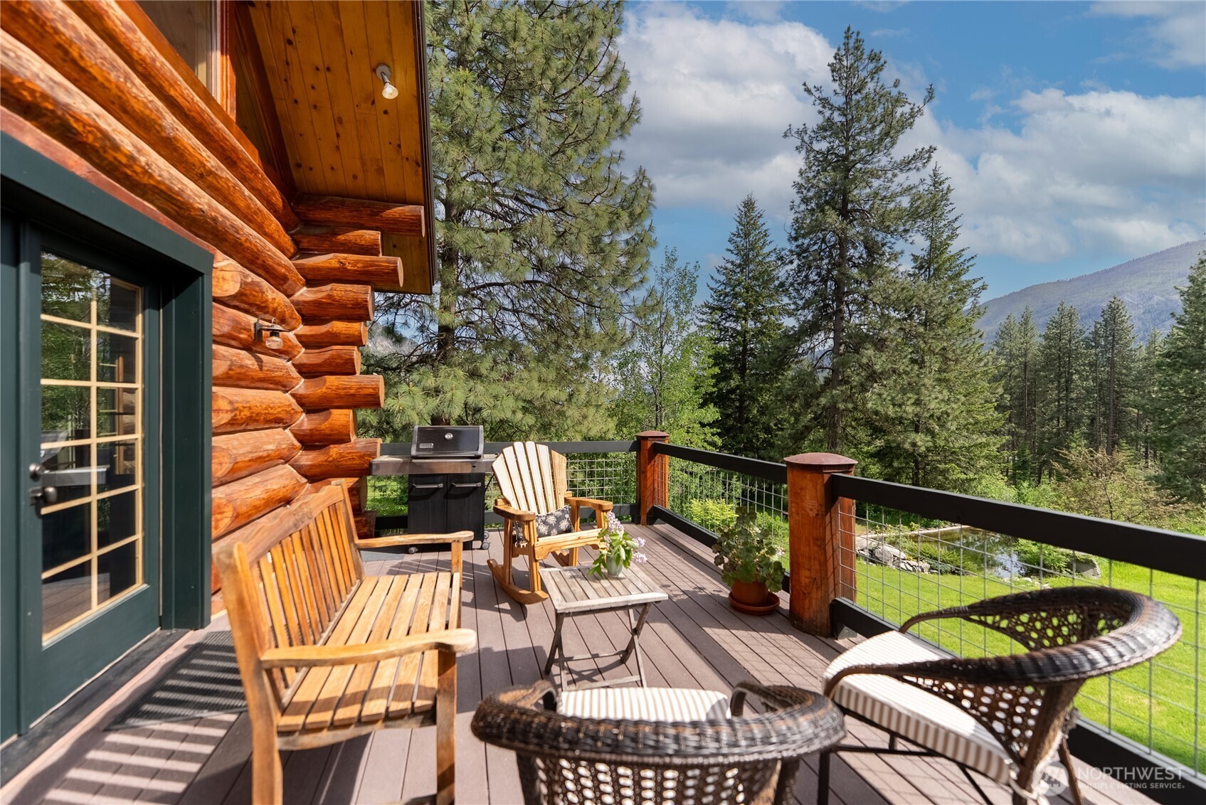 116 Lost River Road Mazama, WA 98833 - Photo 16 of 40 a view of balcony with wooden floor and outdoor seating