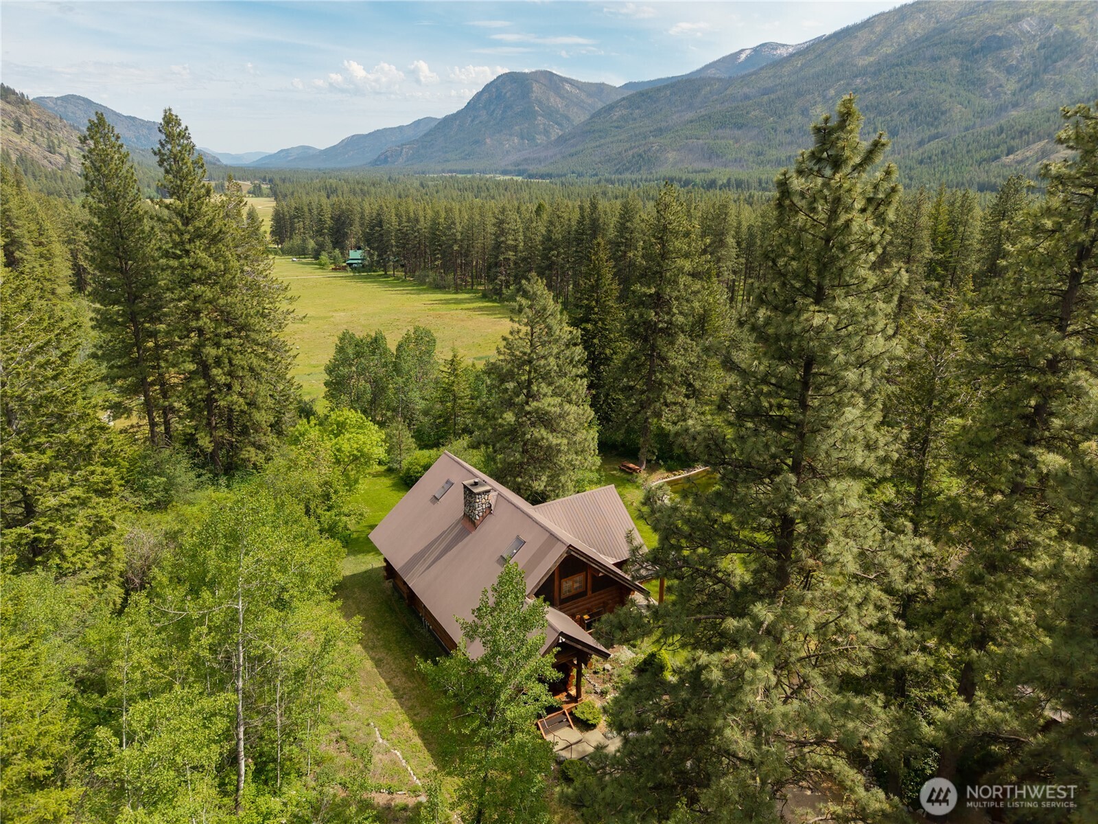 116 Lost River Road Mazama, WA 98833 - Photo 23 of 40 a view of a lake with a mountain in the background