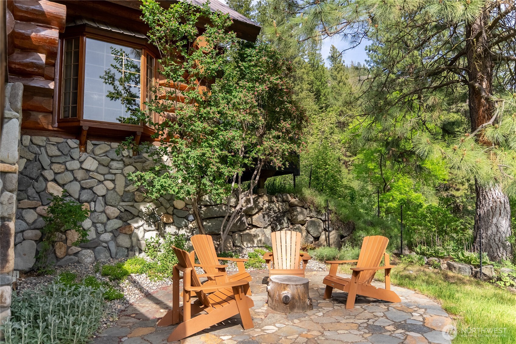 116 Lost River Road Mazama, WA 98833 - Photo 31 of 40 a backyard of a house with outdoor seating