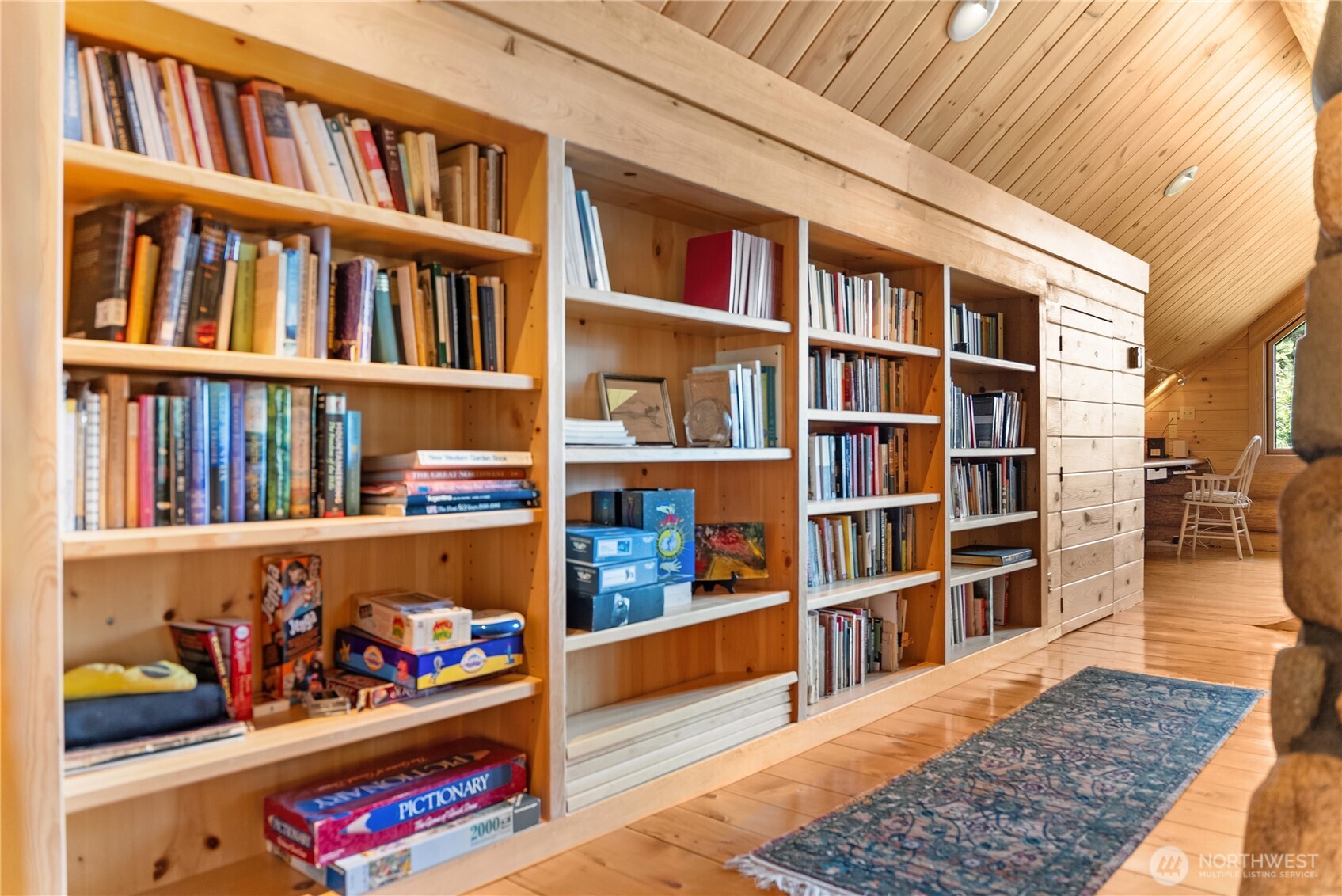 116 Lost River Road Mazama, WA 98833 - Photo 34 of 40 a book shelf with lots of books