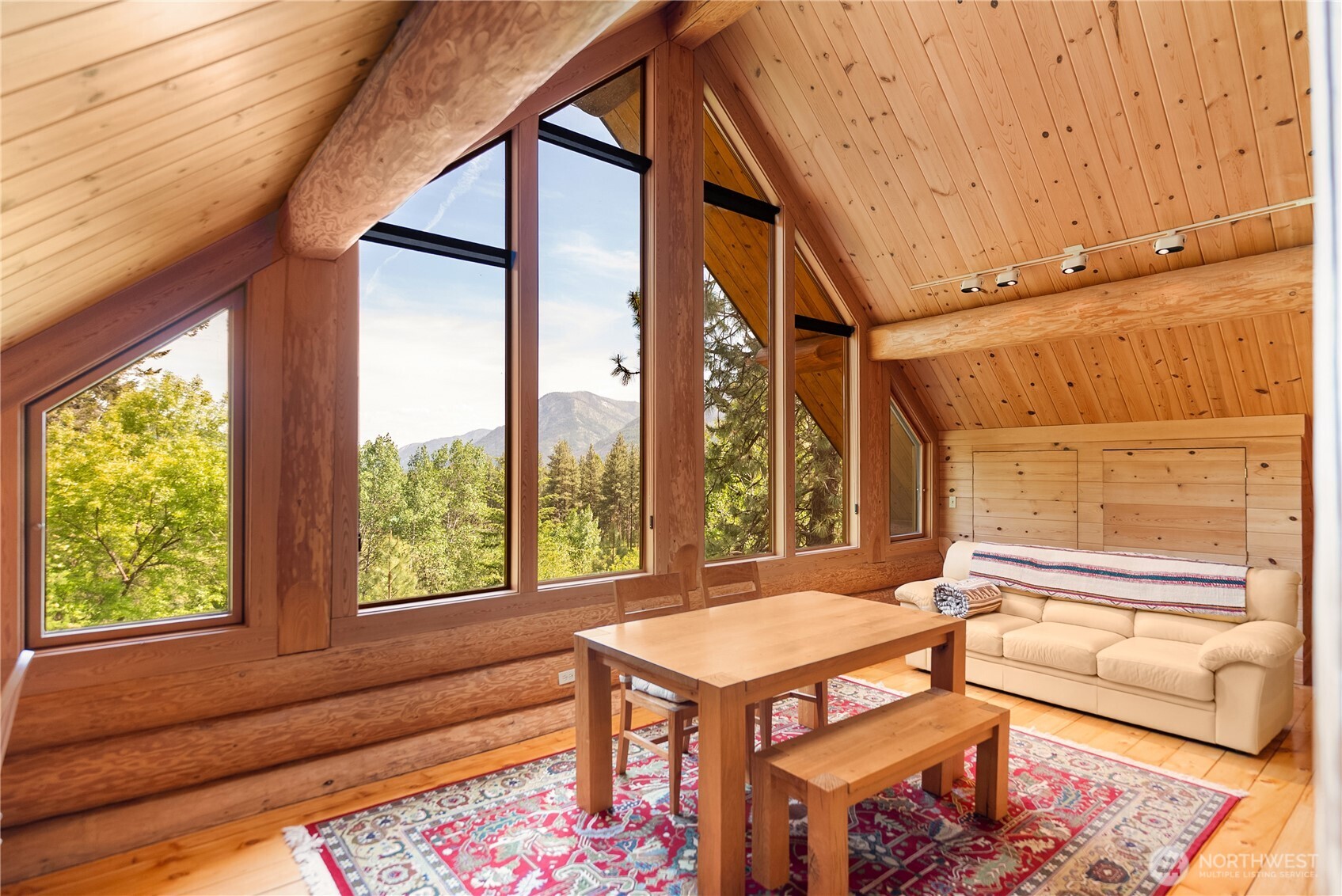 116 Lost River Road Mazama, WA 98833 - Photo 35 of 40 a living room with a couch and a table