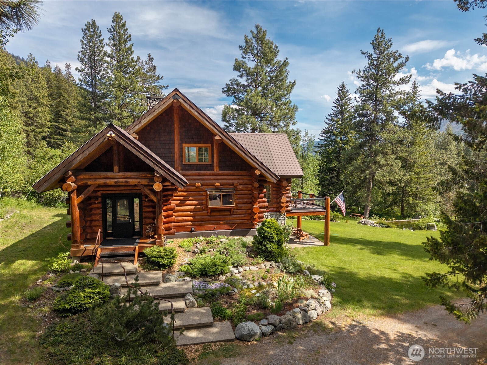 116 Lost River Road Mazama, WA 98833 - Photo 5 of 40 a front view of a house with a yard