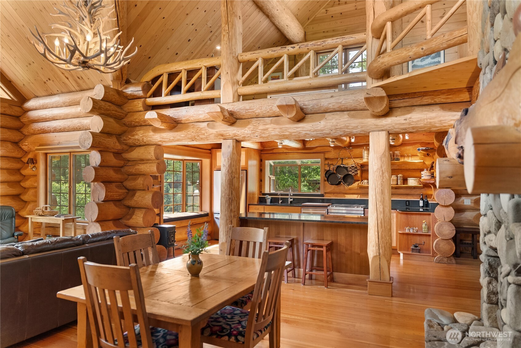 116 Lost River Road Mazama, WA 98833 - Photo 10 of 40 a view of a dining room with furniture window and wooden floor