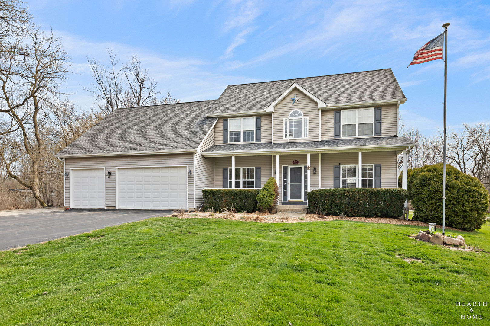 10514 Ridge Lane Marengo, IL 60152 - Photo 1 of 51 a front view of a house with a yard and garage