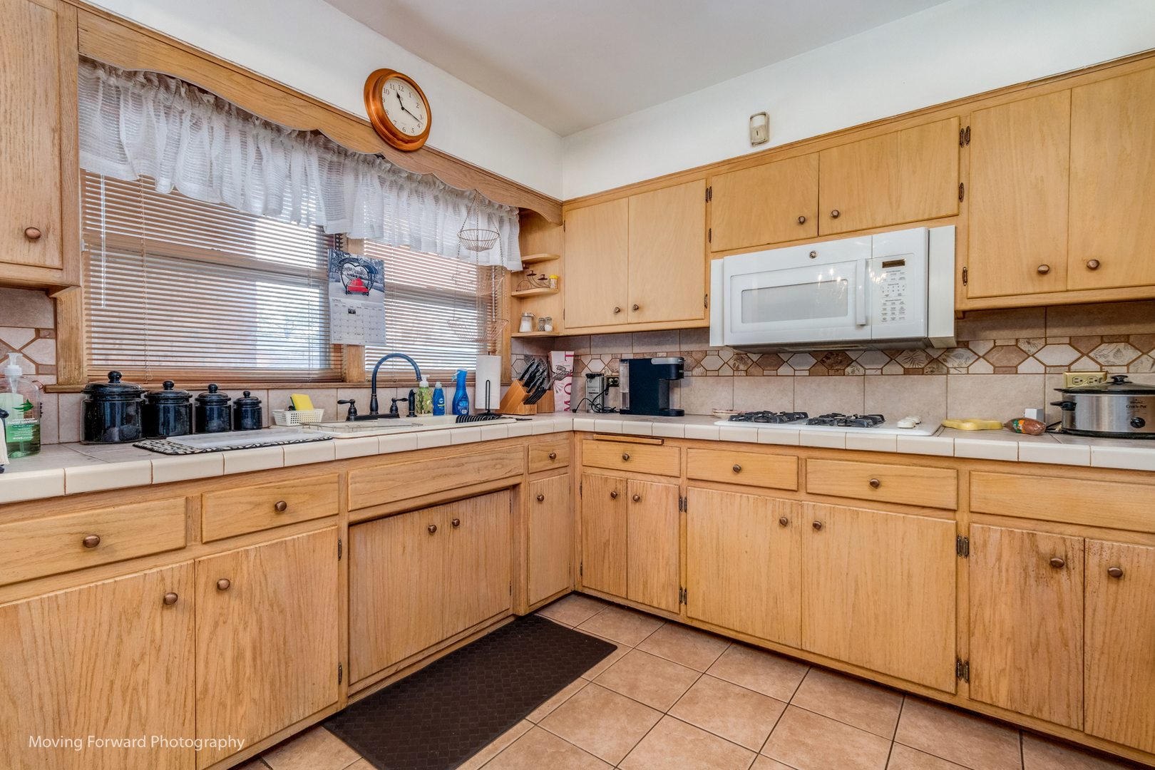Undisclosed Address Chicago, IL 60652 - Photo 7 of 15 a kitchen with cabinets a sink and a stove