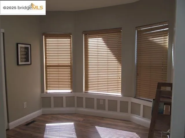 a bathroom with a bathtub and a window
