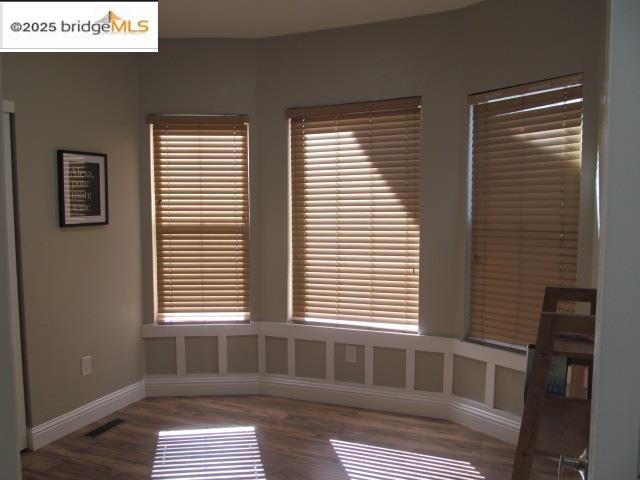 a bathroom with a bathtub and a window