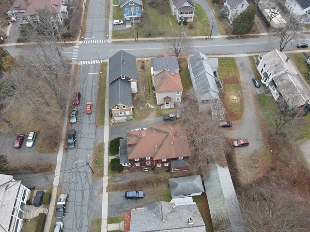 an aerial view of houses with outdoor space