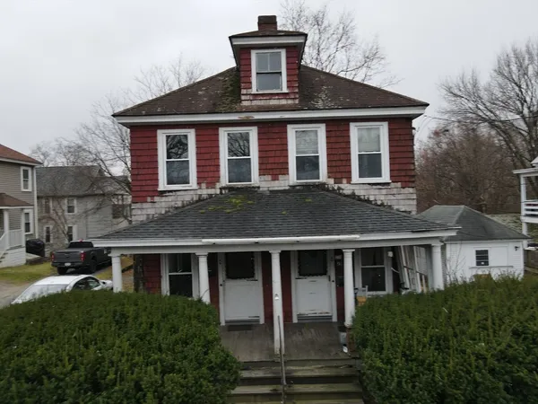a front view of a house with yard