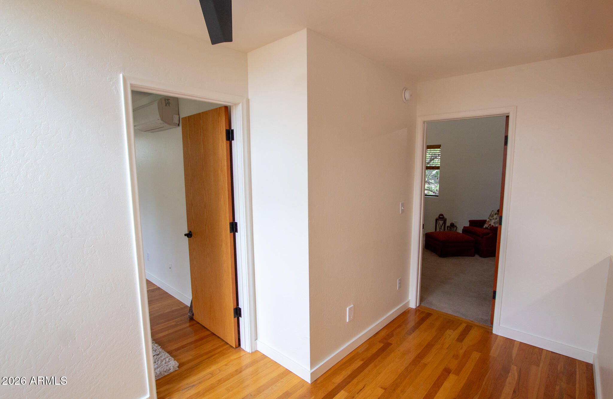 5120 Juniper Loop Pine, AZ 85544 - Photo 14 of 54 a view of a hallway with wooden floor and closet