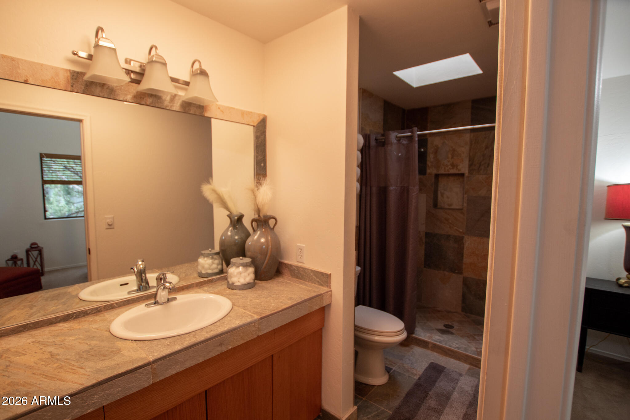 5120 Juniper Loop Pine, AZ 85544 - Photo 17 of 54 a bathroom with a granite countertop sink toilet and shower