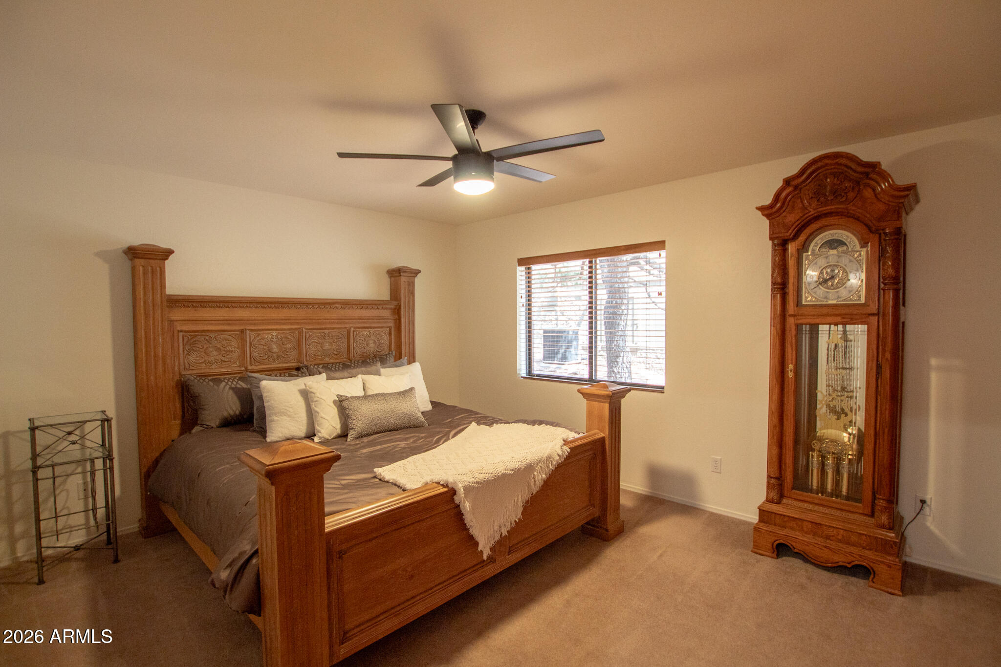 5120 Juniper Loop Pine, AZ 85544 - Photo 23 of 54 a bed room with a bed and a chandelier
