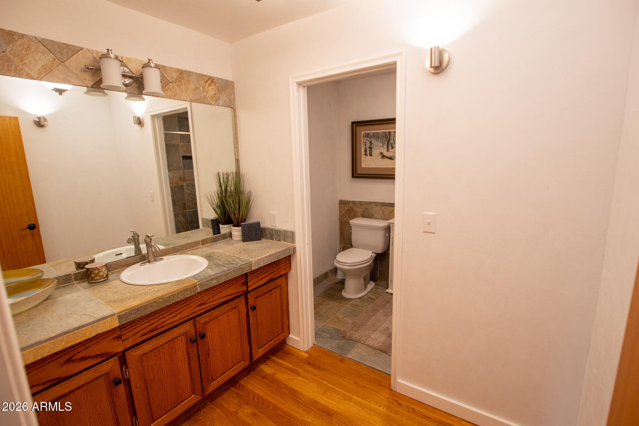 5120 Juniper Loop Pine, AZ 85544 - Photo 24 of 54 a spacious bathroom with a double vanity sink toilet and mirror