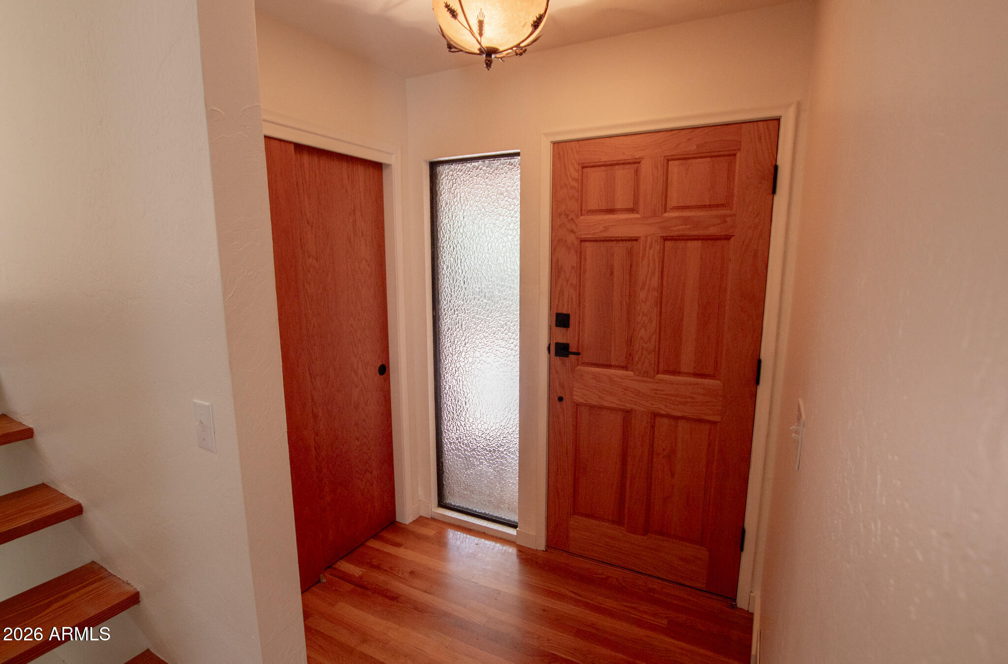 5120 Juniper Loop Pine, AZ 85544 - Photo 27 of 54 an empty room with wooden floor