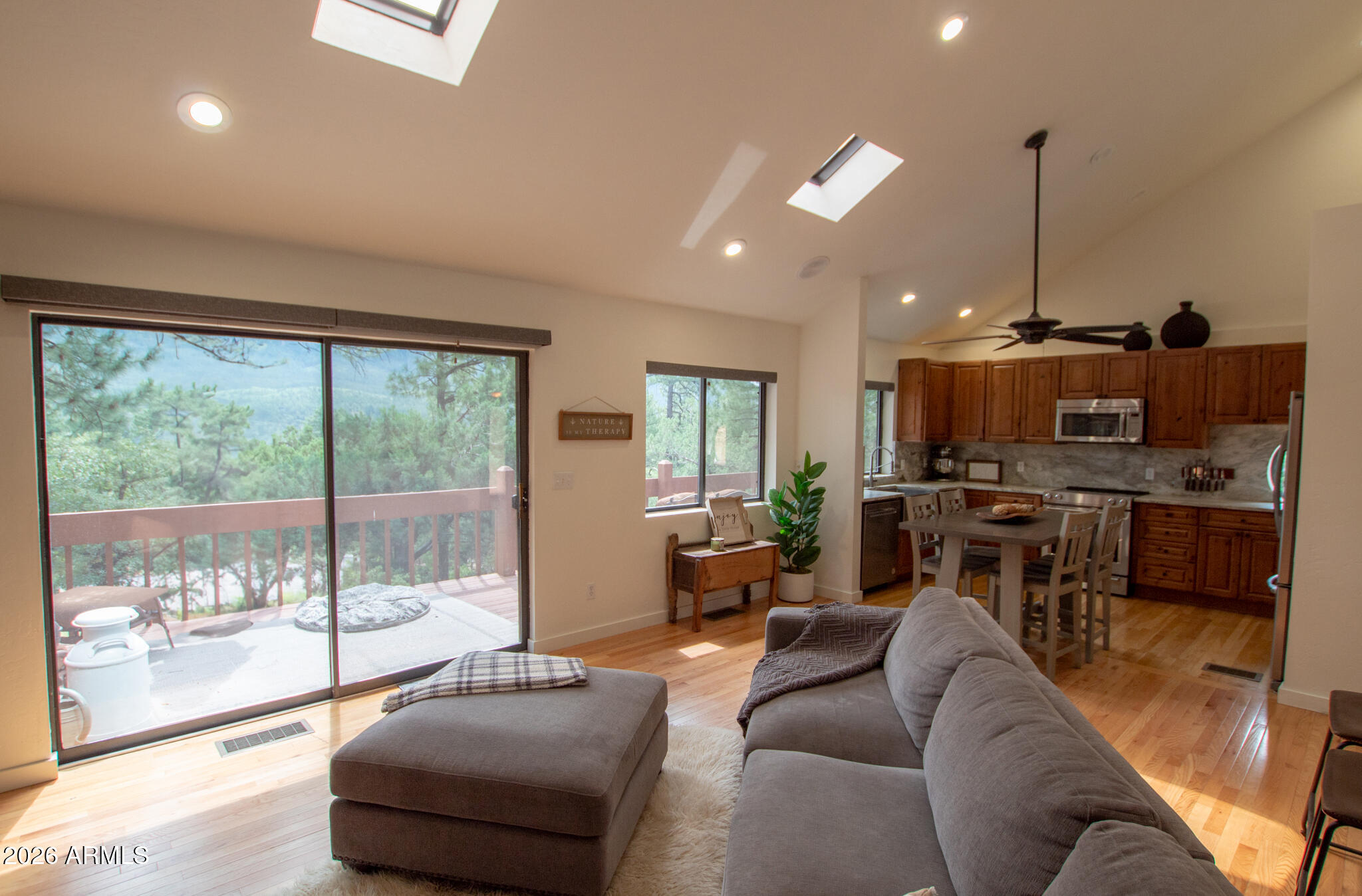 5120 Juniper Loop Pine, AZ 85544 - Photo 3 of 54 a living room with furniture and a floor to ceiling window