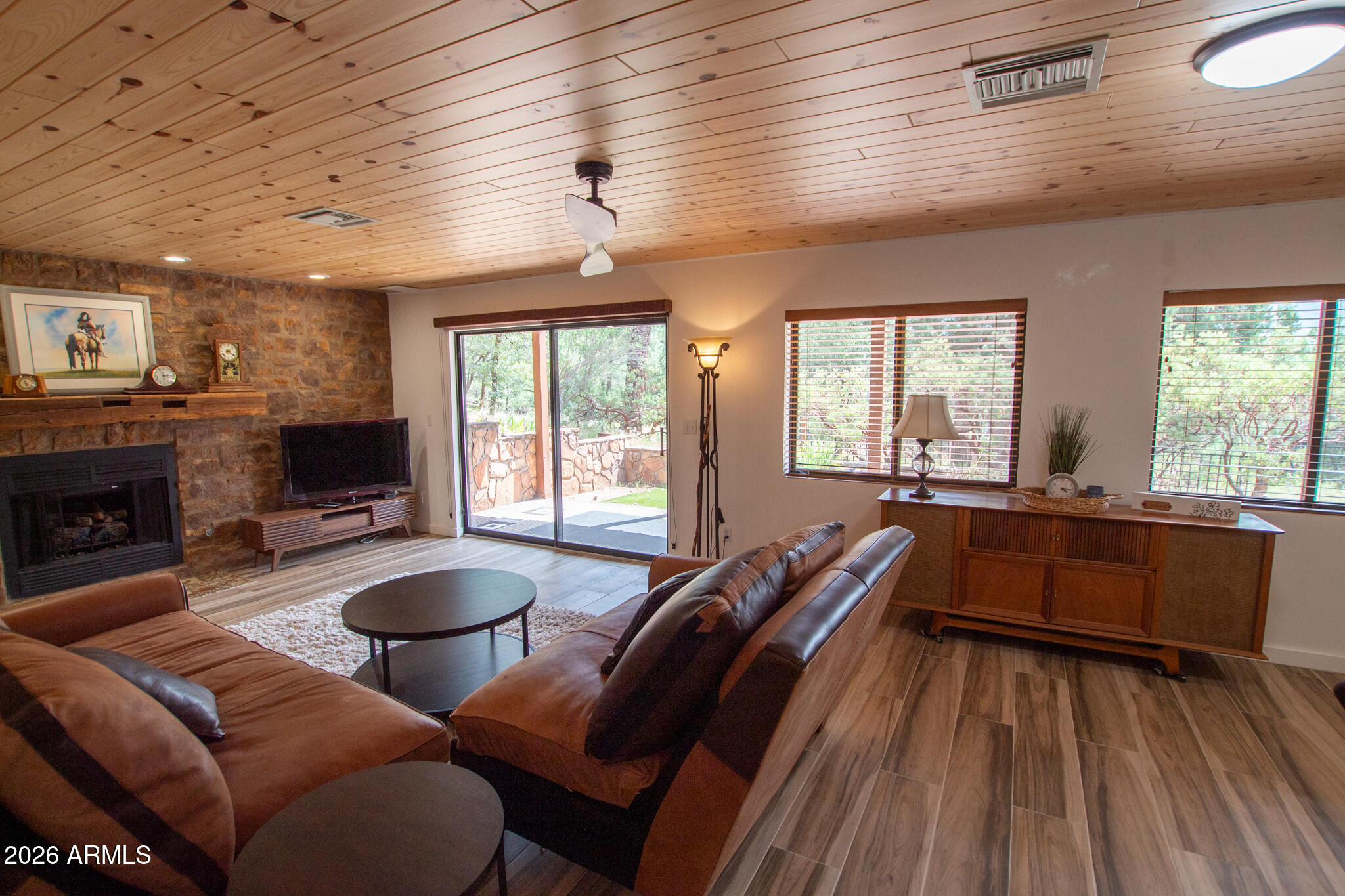 5120 Juniper Loop Pine, AZ 85544 - Photo 33 of 54 a living room with furniture and a fireplace