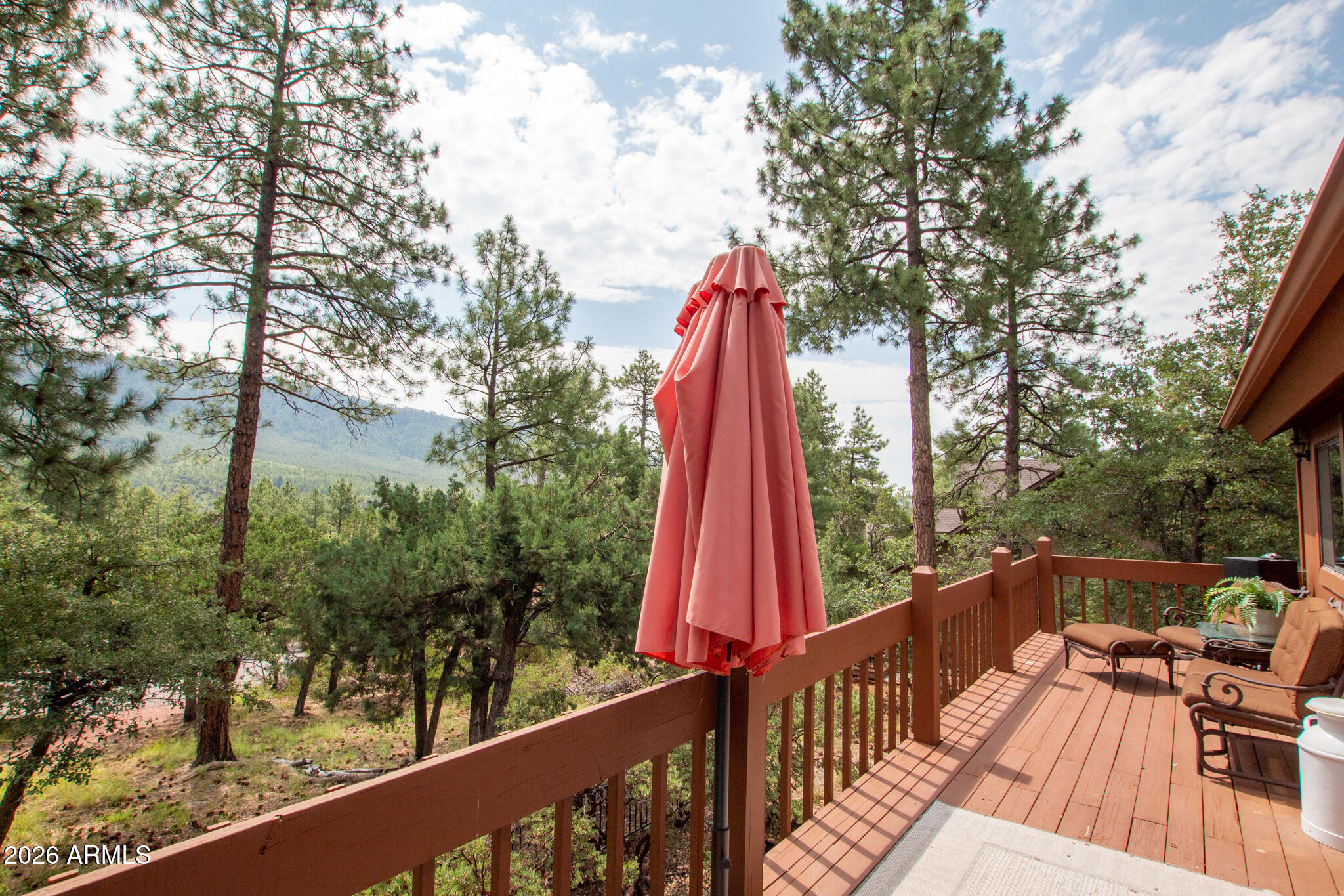 5120 Juniper Loop Pine, AZ 85544 - Photo 39 of 54 a view of roof deck with wooden floor and fence