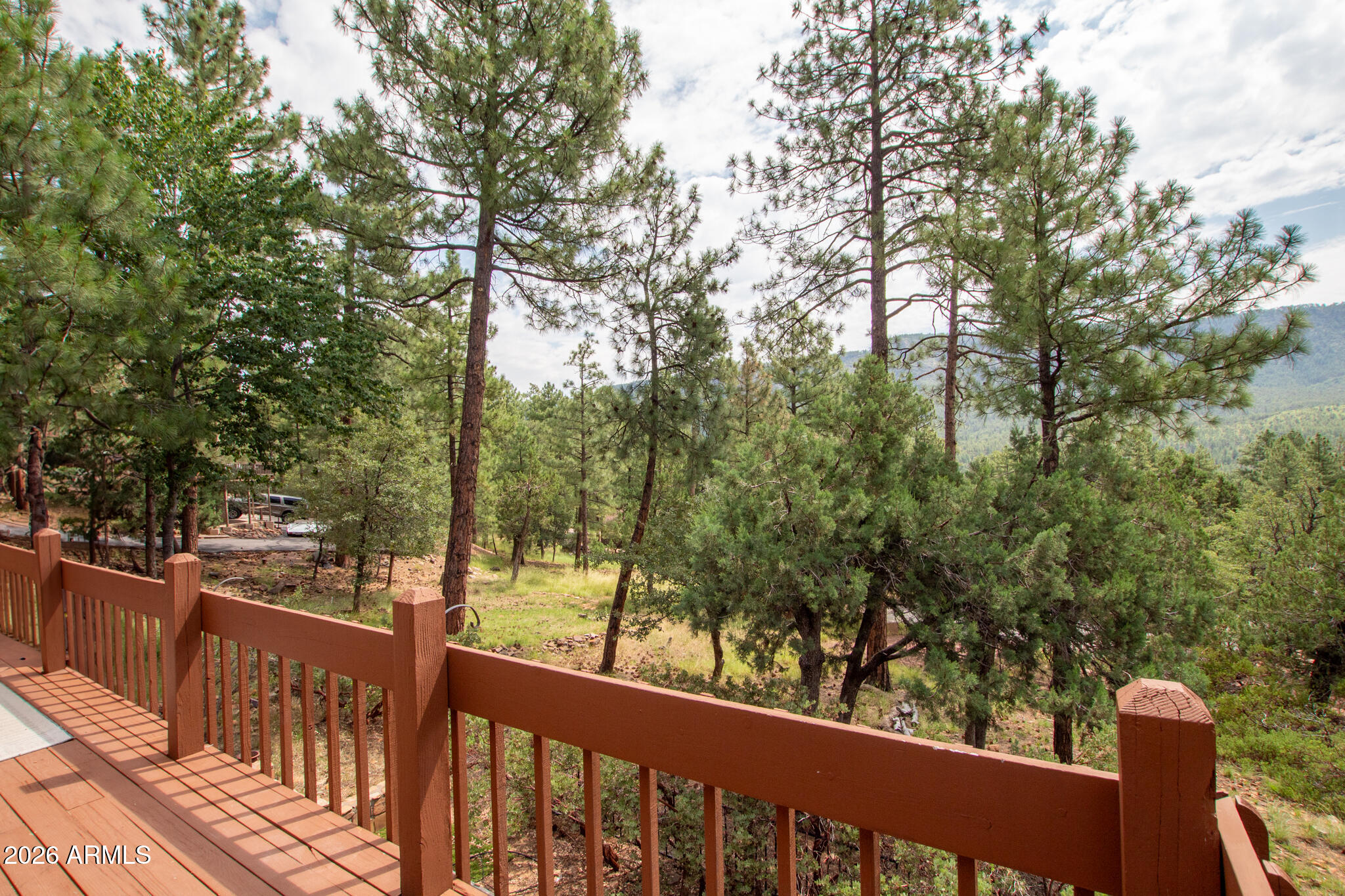 5120 Juniper Loop Pine, AZ 85544 - Photo 42 of 54 a view of a wooden deck next to a yard