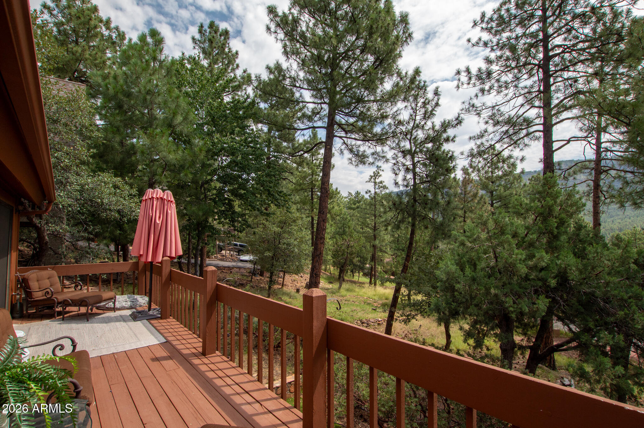 5120 Juniper Loop Pine, AZ 85544 - Photo 43 of 54 a view of a balcony with wooden floor and outdoor space