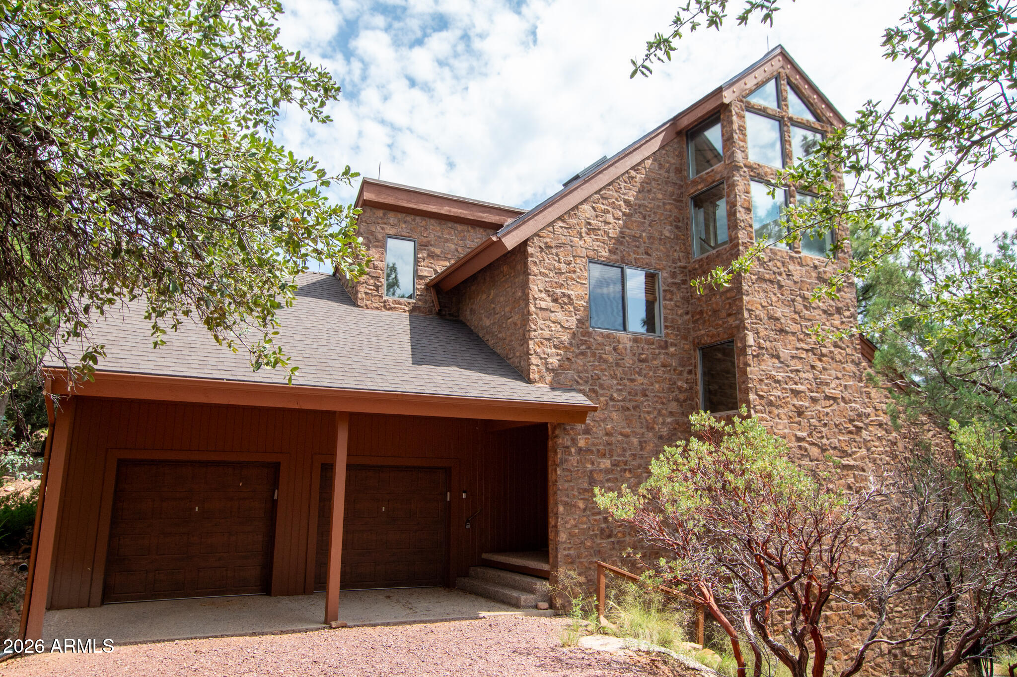 5120 Juniper Loop Pine, AZ 85544 - Photo 45 of 54 a front view of a house with a tree