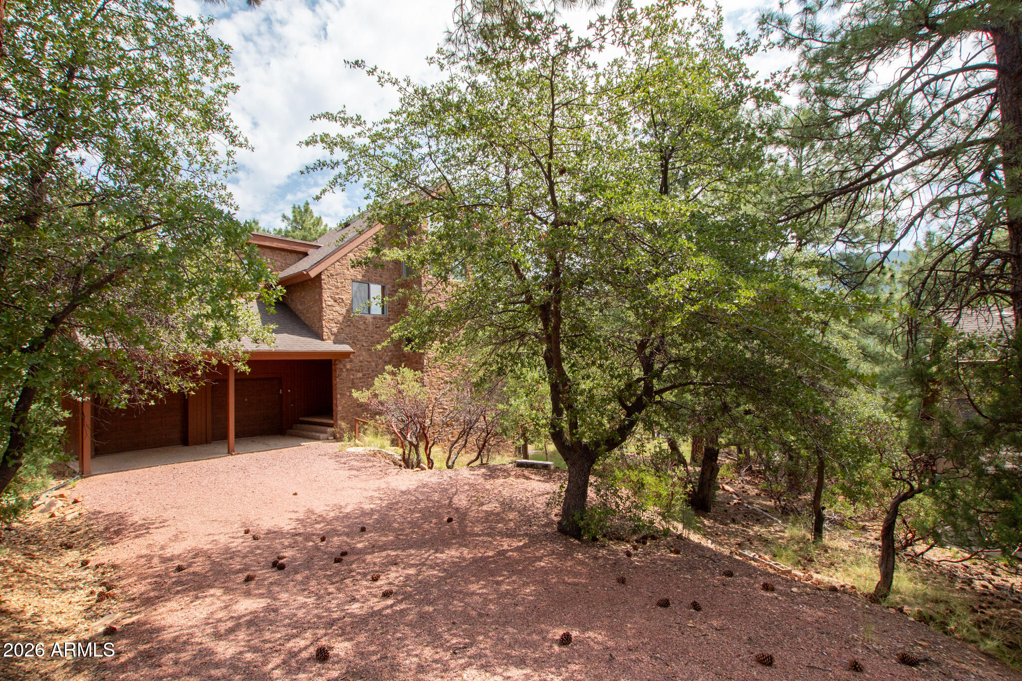 5120 Juniper Loop Pine, AZ 85544 - Photo 46 of 54 a view of a house with a yard and tree