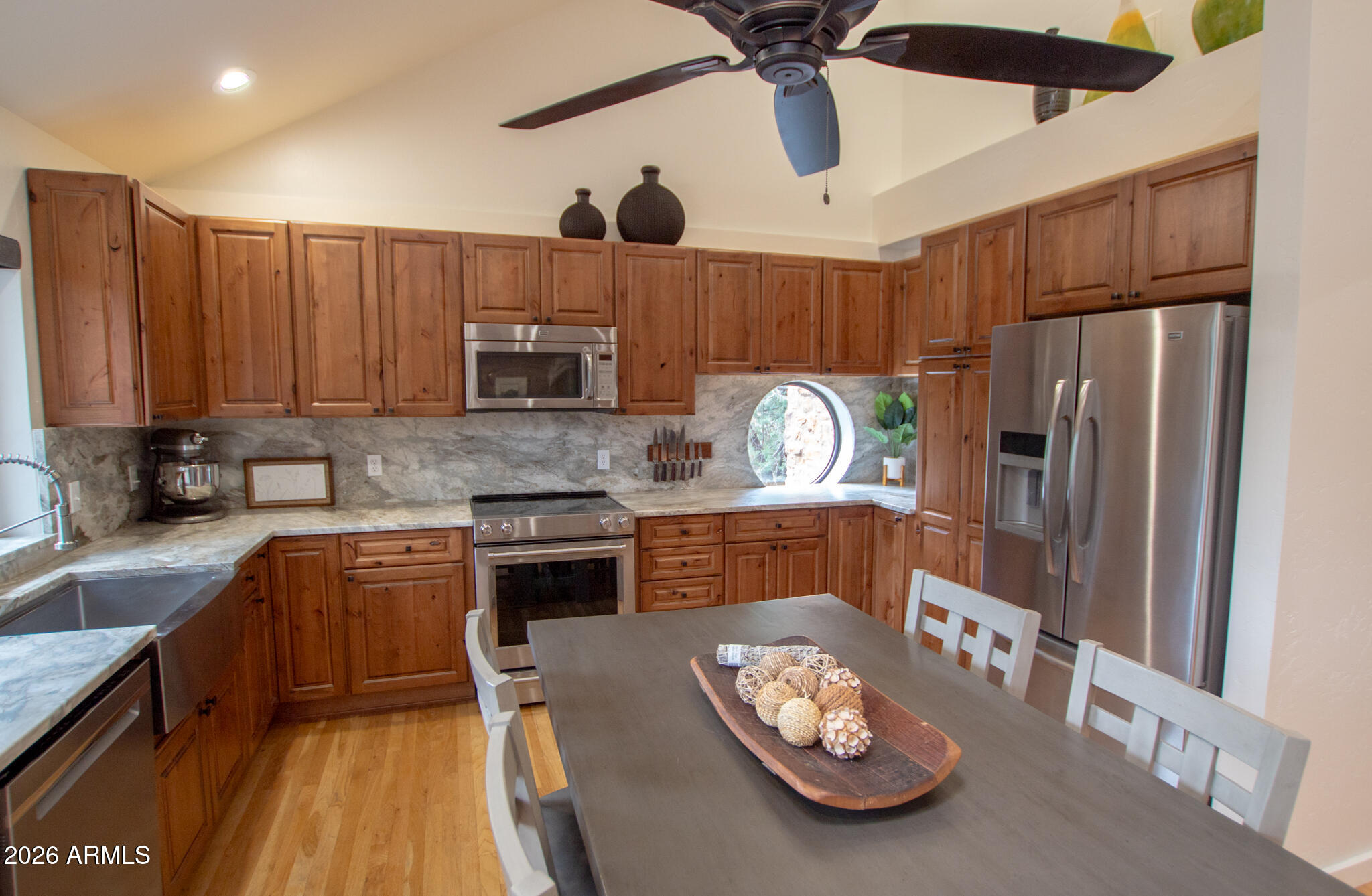 5120 Juniper Loop Pine, AZ 85544 - Photo 5 of 54 a kitchen with stainless steel appliances granite countertop a refrigerator a stove and a sink