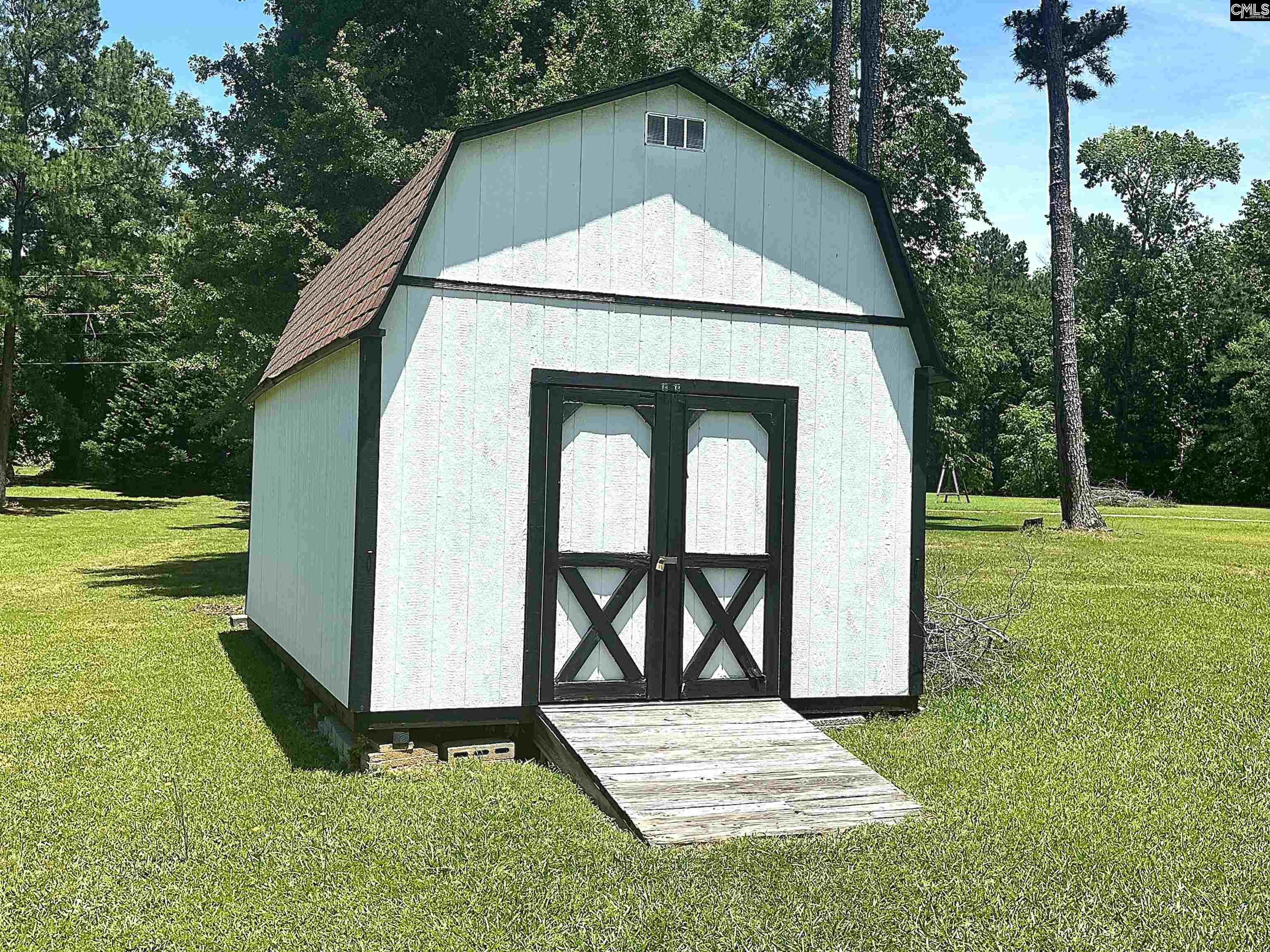 535 Sandbar Road Chapin, SC 29036 - Photo 7 of 23 a backyard of a house with table and chairs