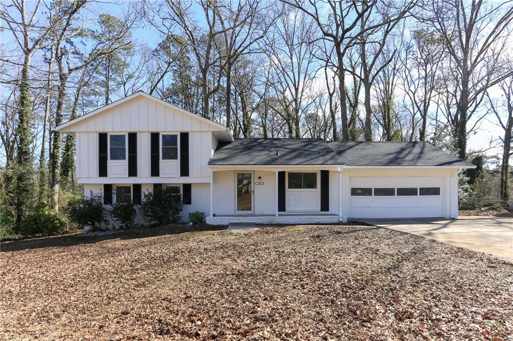 1462 Walnut Ridge Way Stone Mountain, GA 30083 - Photo 1 of 1 front view of a house with a yard