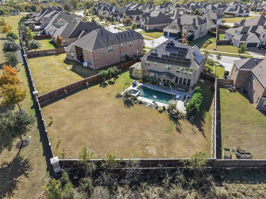 a aerial view of a house with a yard