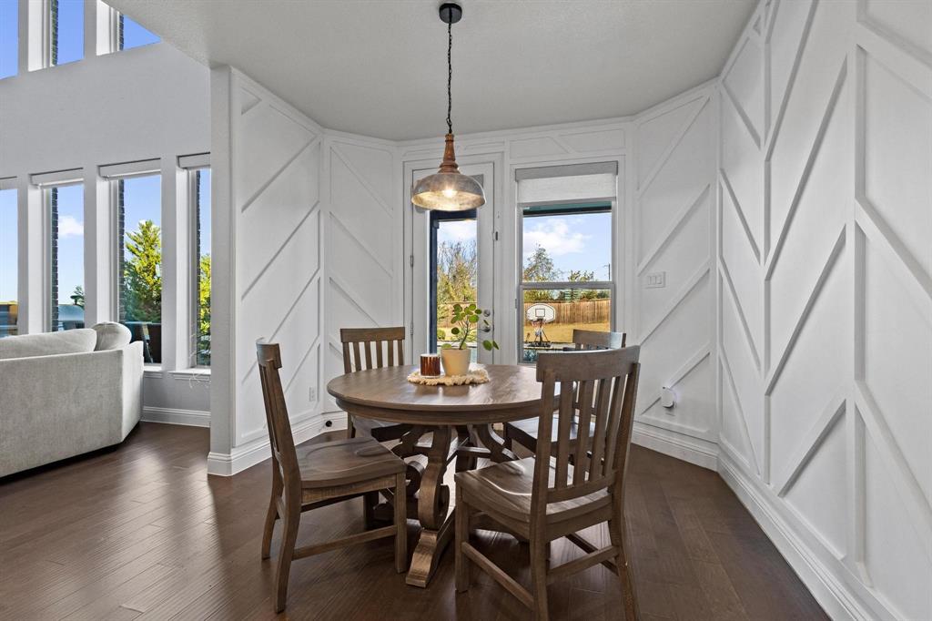 13798 Fernando Road Frisco, TX 75035 - Photo 15 of 39 a dining room with furniture a chandelier and wooden floor